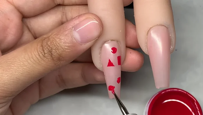 Employ the dotting tool for creating dots, cheetah print designs, and cloud nail art.