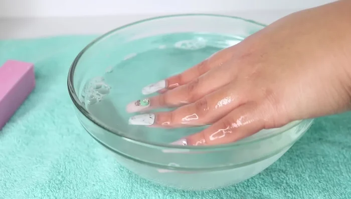 Pull the nails off from side to side.