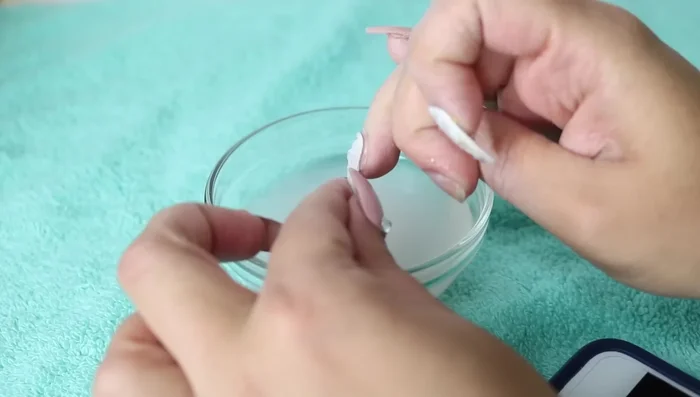 Use a side-to-side motion to remove the nails gently. Don't pull them off forcefully to avoid damaging your natural nails.