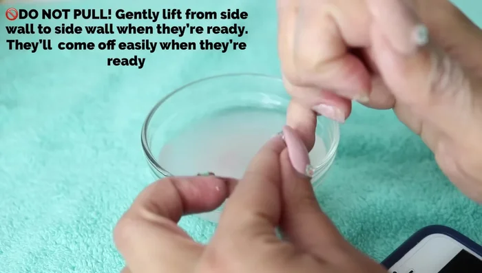 If nails are difficult to remove, continue soaking.