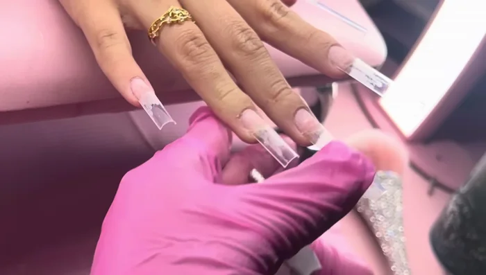Blend nail tips using a 240 grit sanding band.