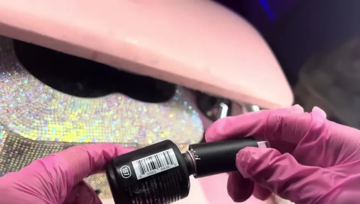 Apply a matte top coat or base coat before nail art.