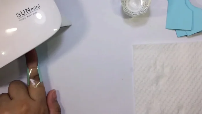 Apply a thin layer of nail polish to avoid building up.