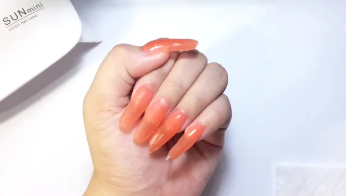 Remove nail forms carefully using alcohol and tissue paper.