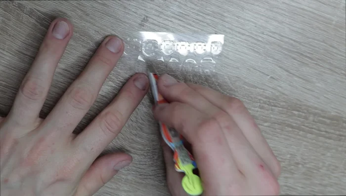 Use tweezers to ensure sticky tabs are pressed flat against the nails.