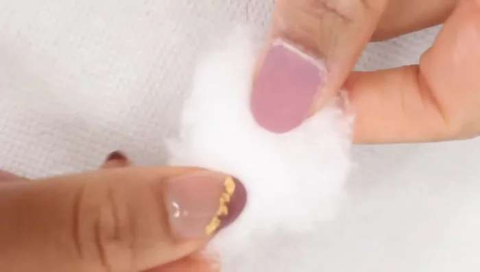 Place the saturated cotton ball on your nail.