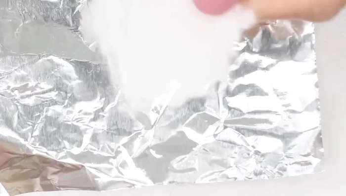 Saturate a cotton ball with 100% acetone.