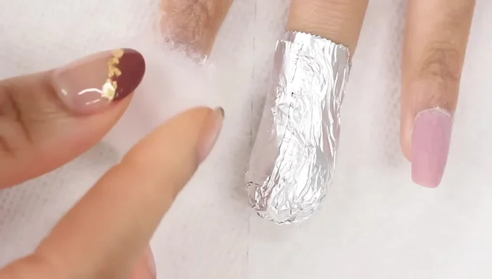 Remove the shiny top coat using a nail file (180 grit), e-file, or buffing block (medium grit).