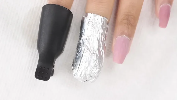 Remove the shiny top coat using a nail file (180 grit), e-file, or buffing block (medium grit).