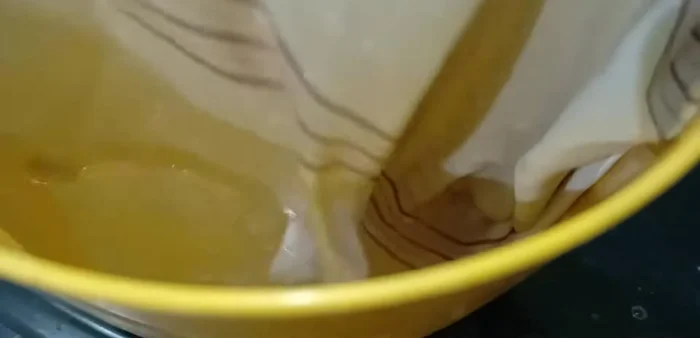 Wash the cloth in plain water.