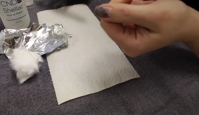 Buff the top of each nail to roughen the surface and remove shine.