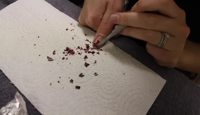 Use a nail file to lightly buff any stubborn shellac residue.