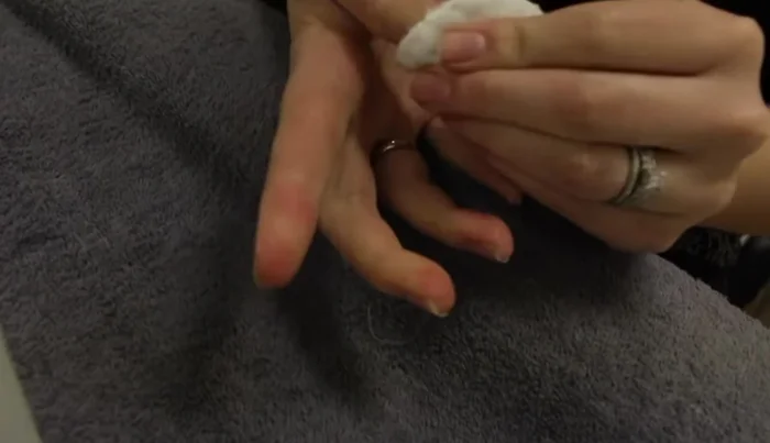 Cleanse nails with shellac remover on a cotton round to remove any remaining residue.