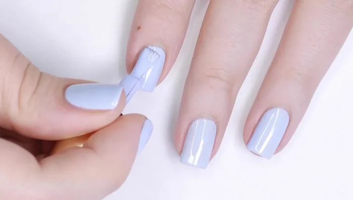 Apply a second thin layer of gel polish (if needed), capping the free edge and curing.