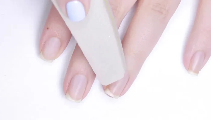 Apply primer (optional) to dehydrate nails and increase longevity.