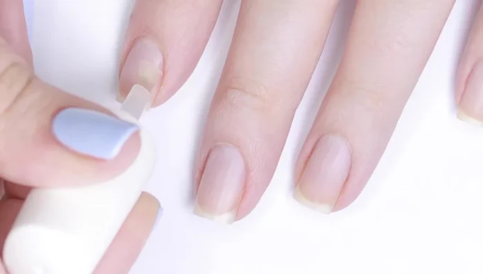 Apply primer (optional) to dehydrate nails and increase longevity.