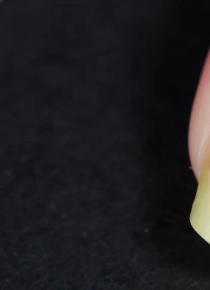 Dehydrate your nails with rubbing alcohol, nail polish remover, or acetone.