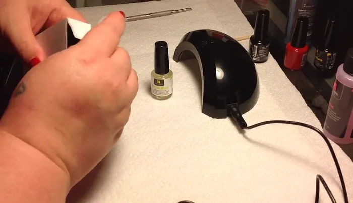 Red Carpet Manicure LED gel system in use