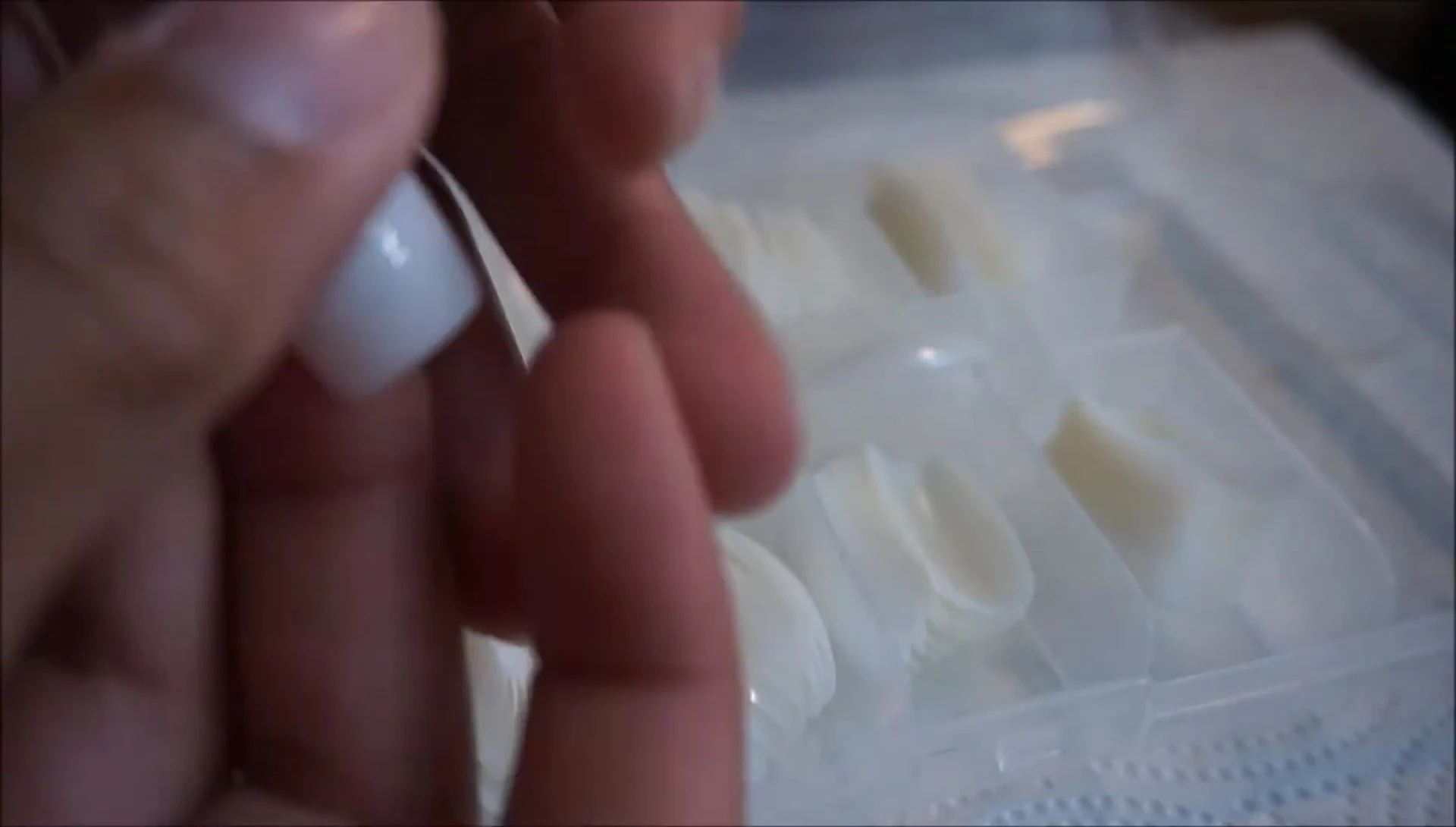 Fitting Kiss press-on nails before gluing.