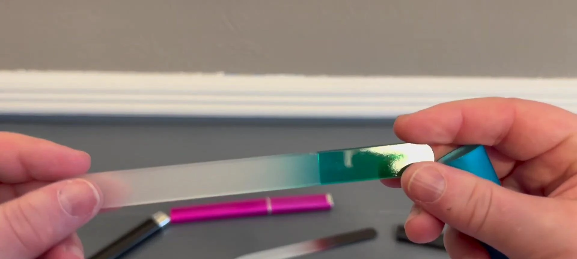 Close-up shot of the blue nail file, showing the ombre effect.