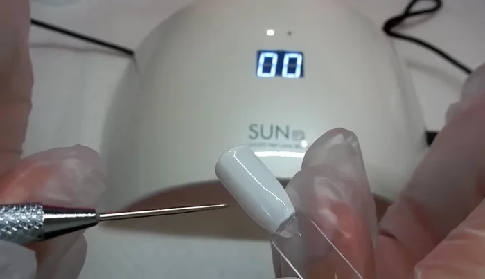 Test the cure with a pointy tool. If not fully cured, cure for a full minute.