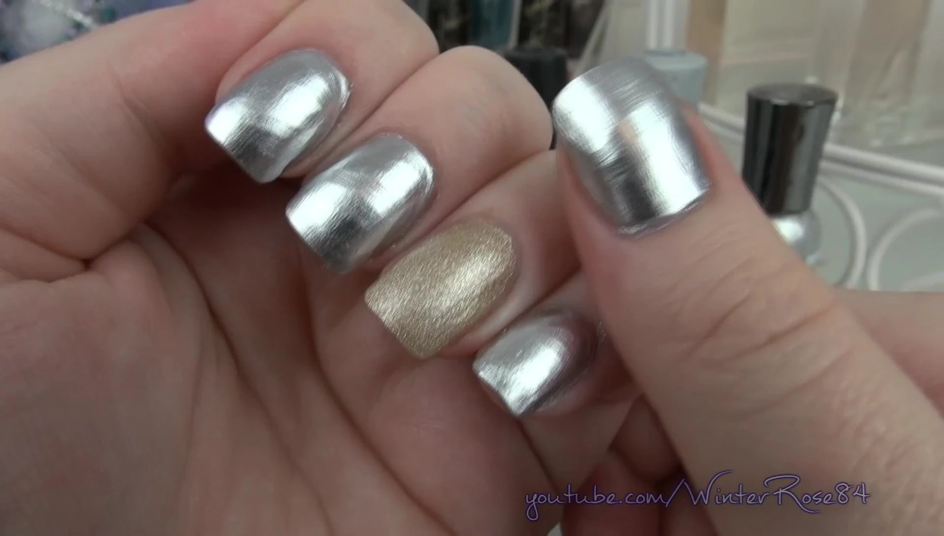 Close-up showing chipped and faded polish after one day of wear.