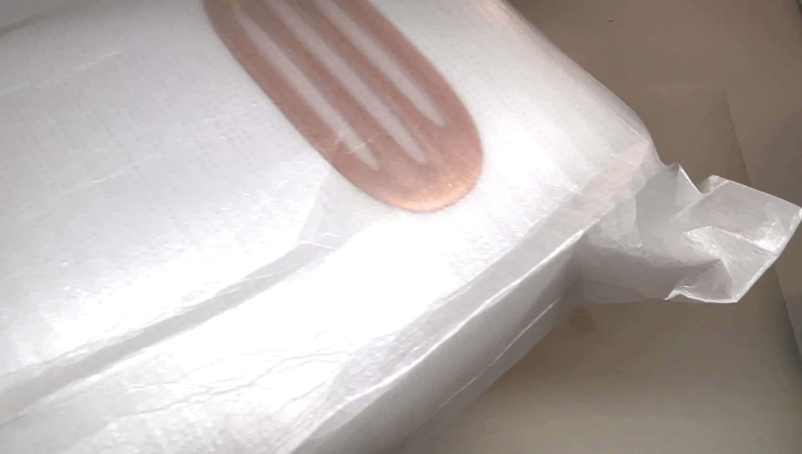 The M&R 701Pro UV/LED nail lamp being taken out of its packaging.