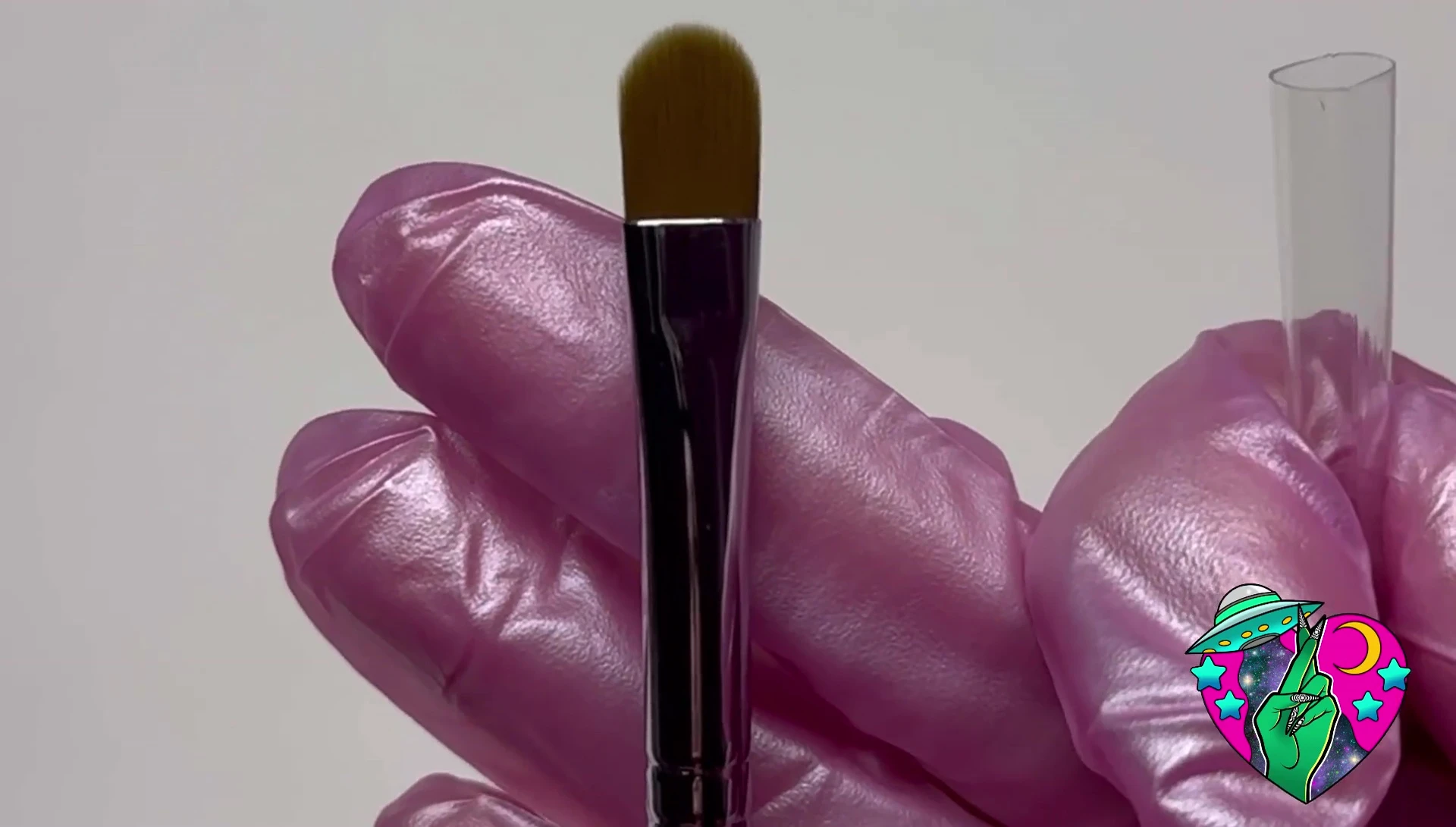 Close-up of the As If Ombré brush and the hand holding it.