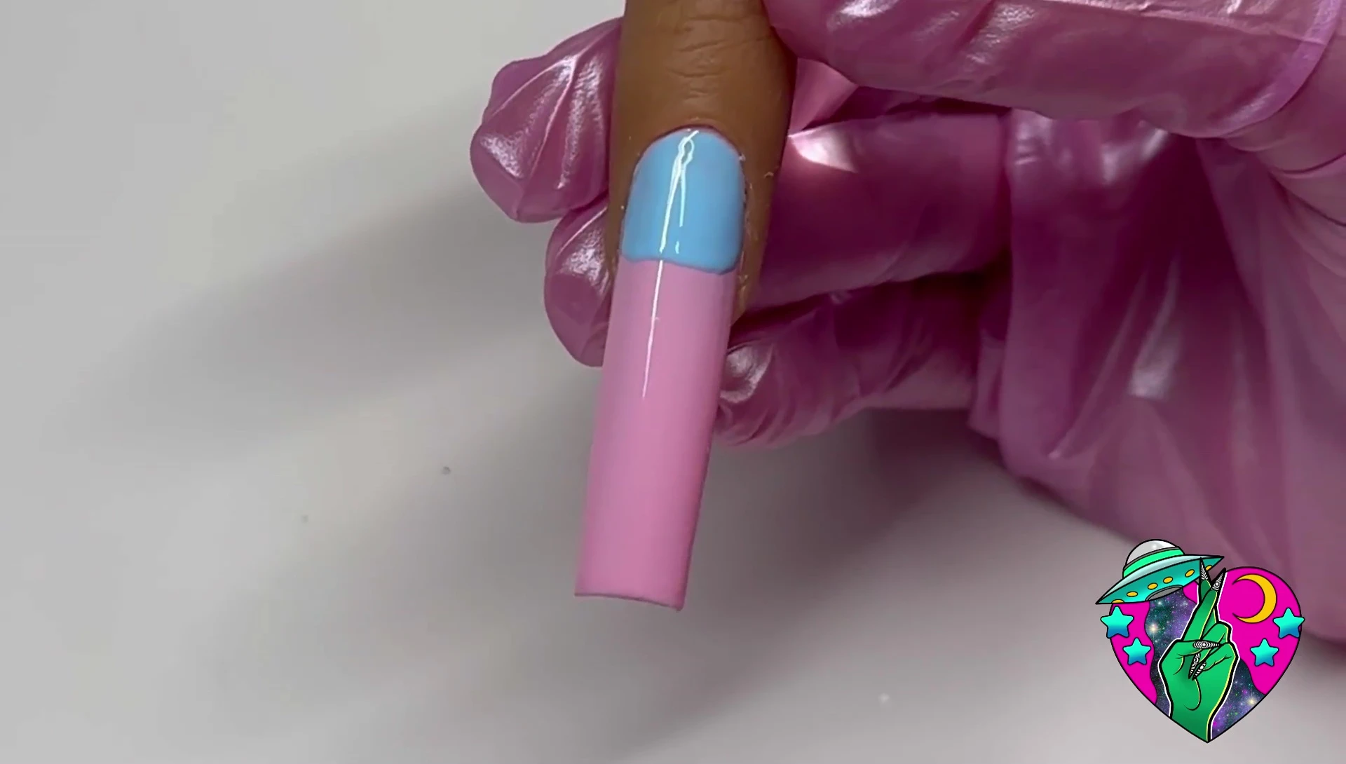 Demonstrating the correct angle to hold the brush for ombre technique.