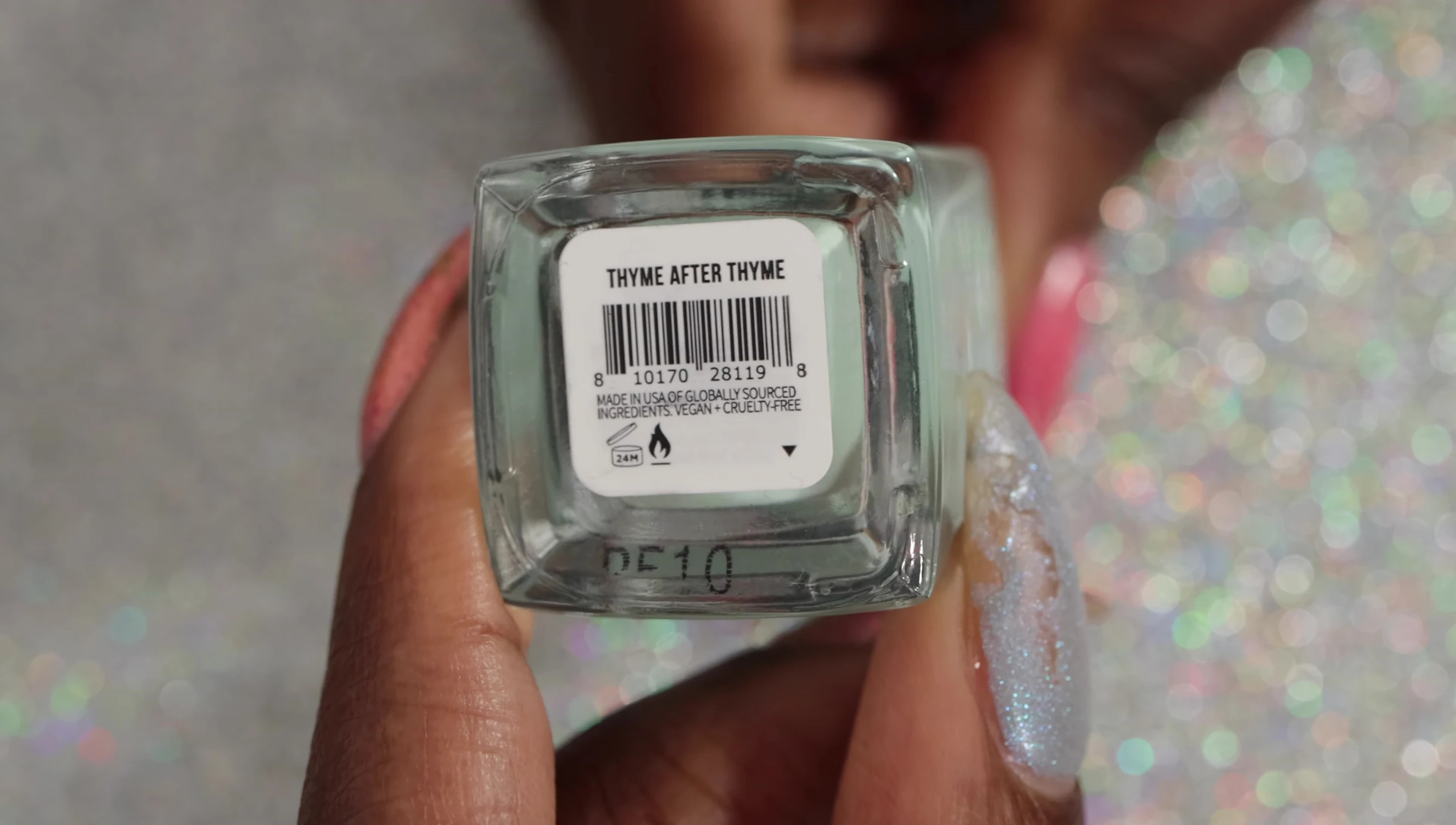 Close-up of Time After Time polish, showing its cool sage green color.