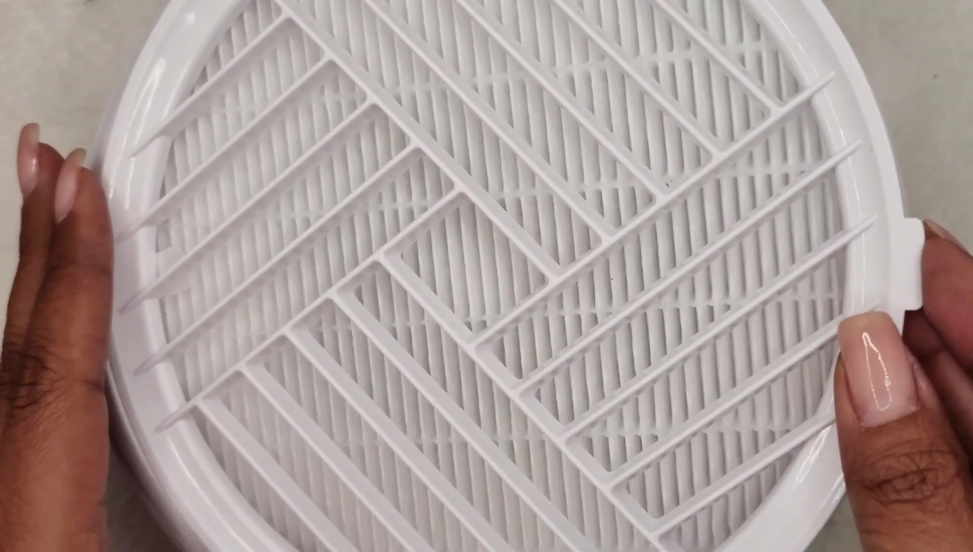 Demonstrating how easily the filter can be removed.