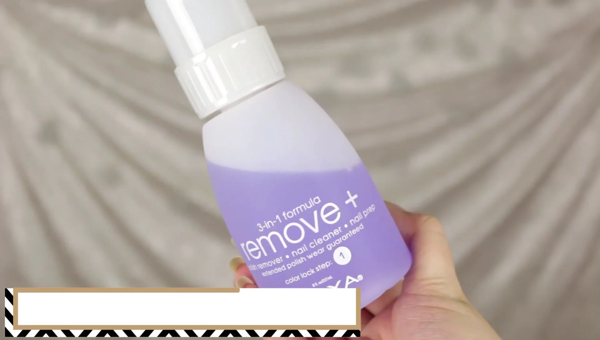 Close-up of the nail polish remover bottle with pump dispenser