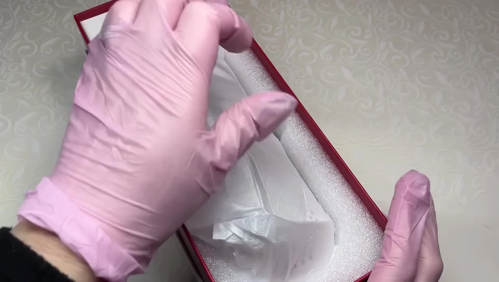 The nail lamp being removed from the box