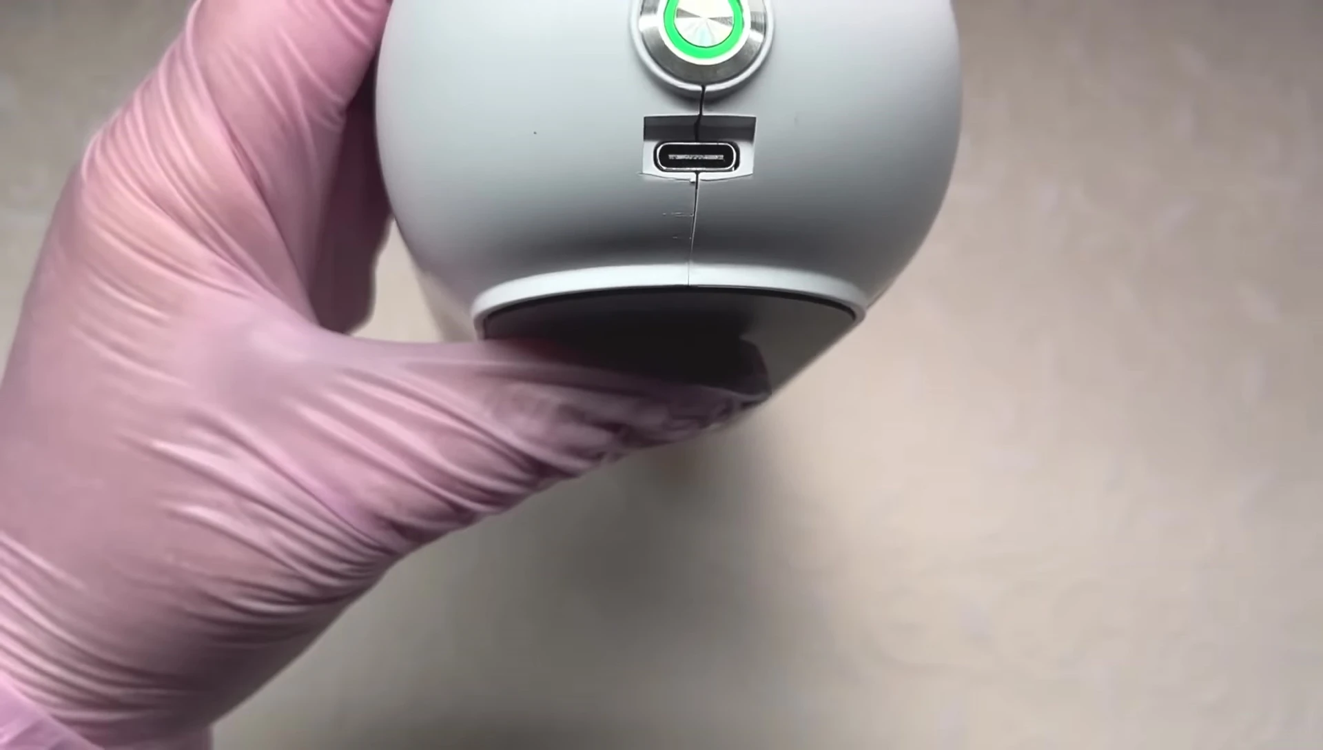 Locating the charging port on the back of the lamp