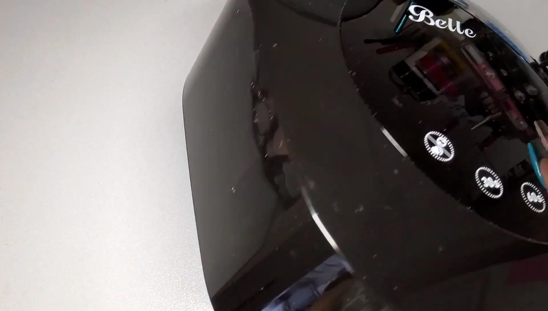 Demonstrating the ease of attaching and removing the magnetic base.