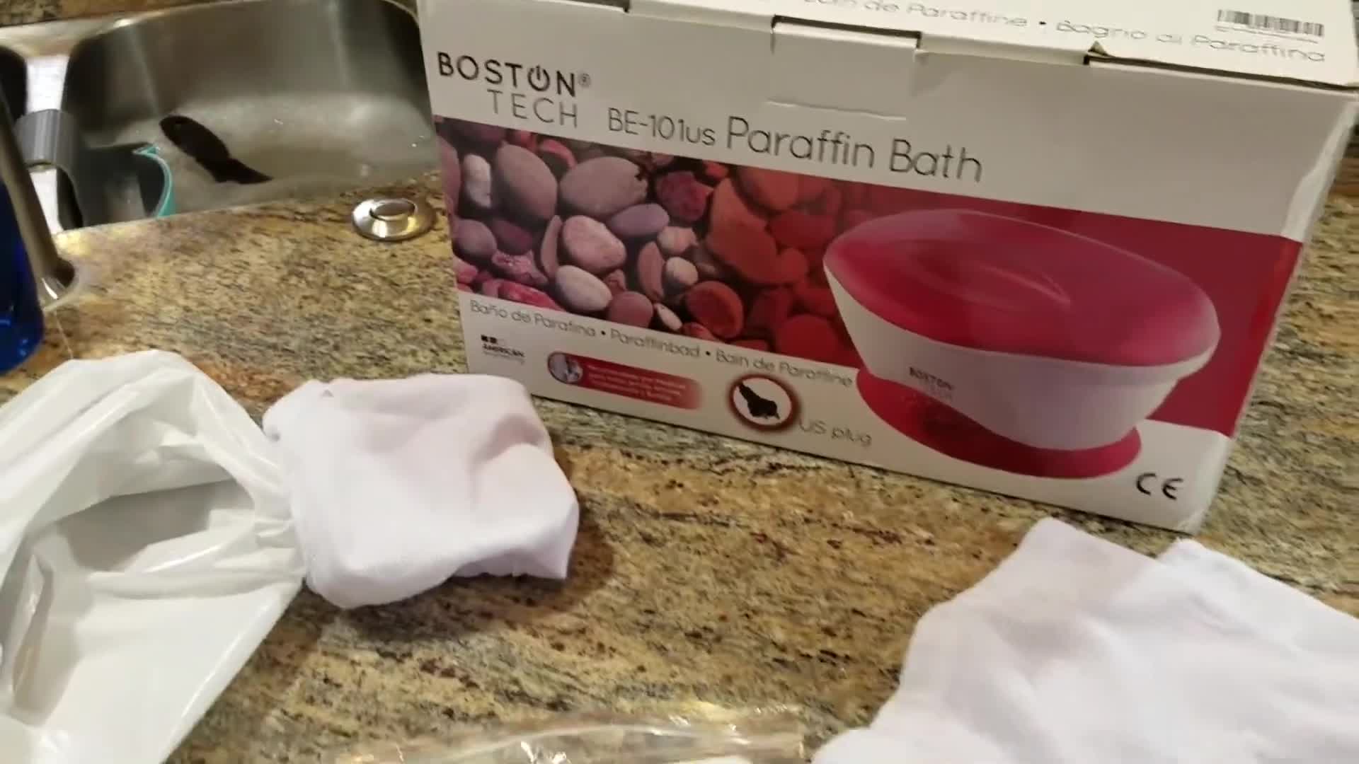 Close-up of the package contents: manual, plastic bags, and socks.
