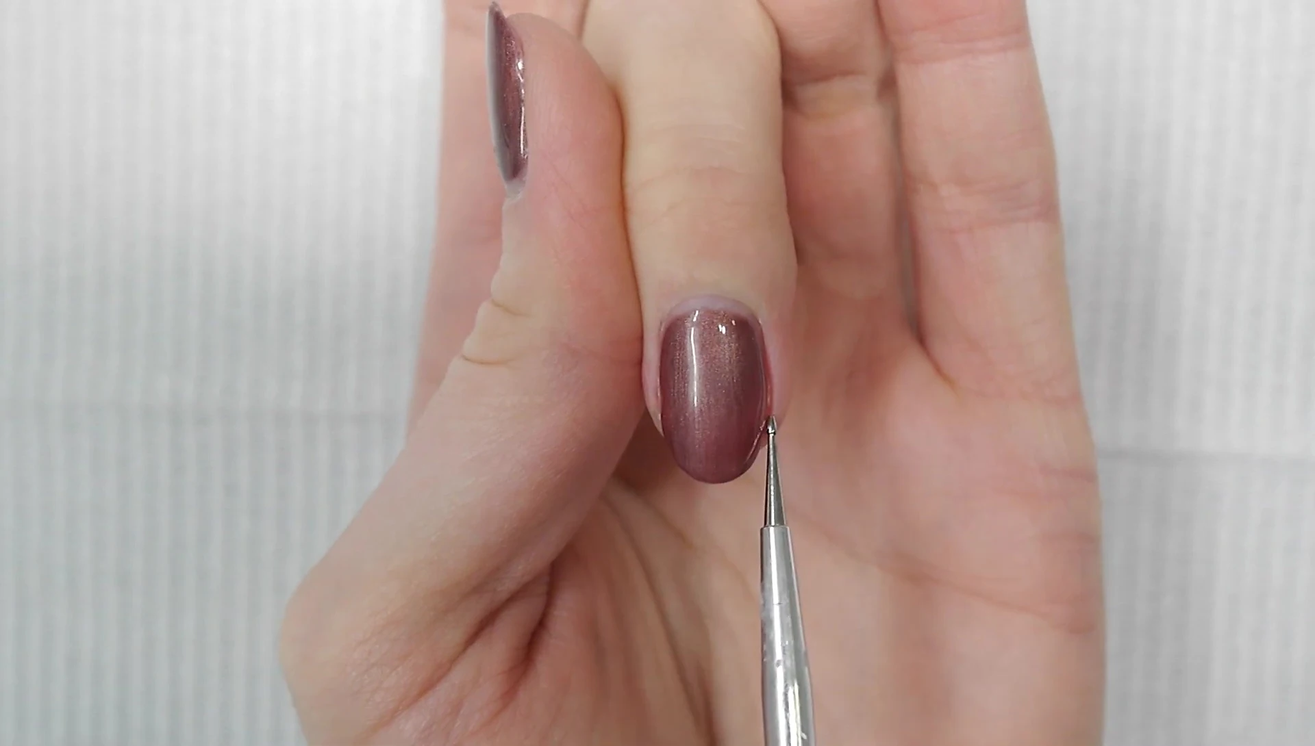 Marking the points on the nail form for the 45-degree angle cut.