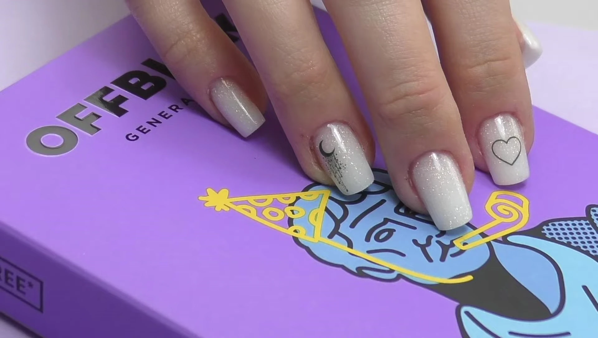 Final shot of the finished nails and the reviewer.