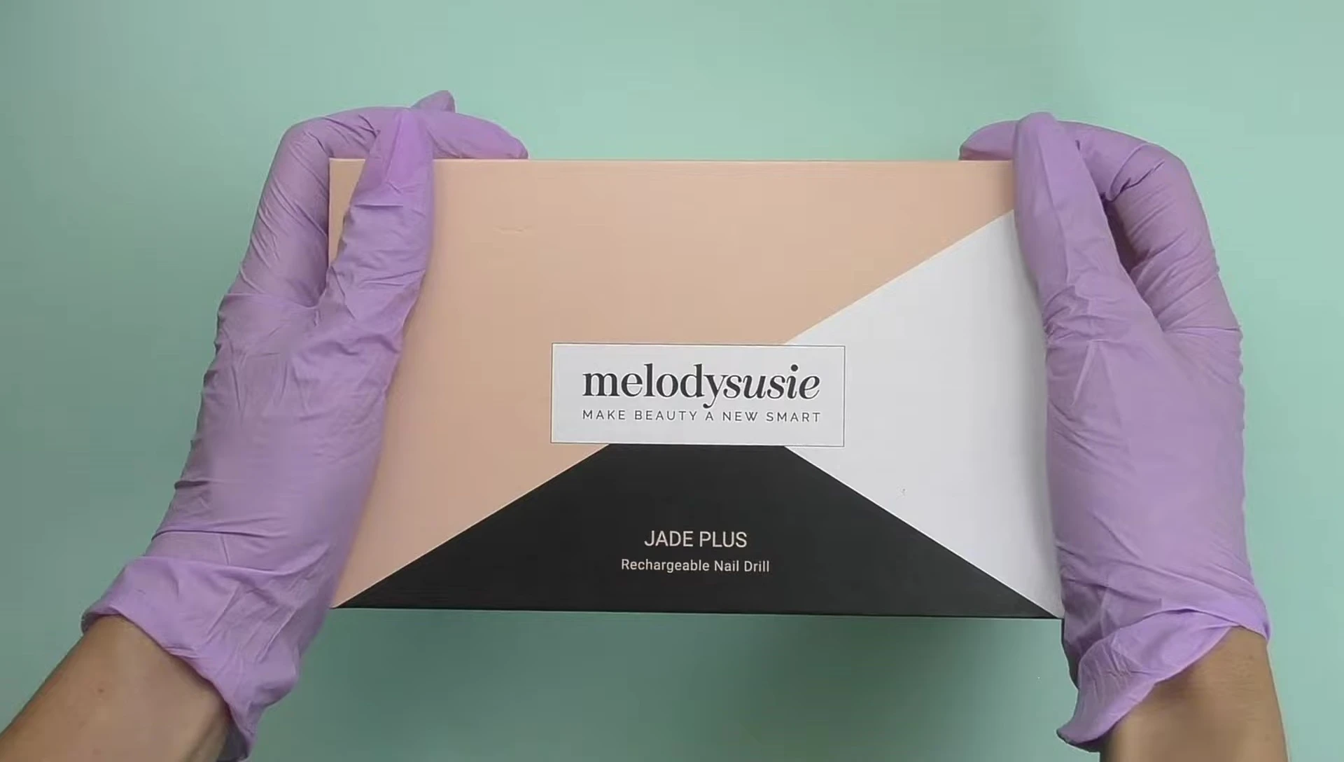 Close-up of the small box containing the Melodysusie Jade Plus nail drill.