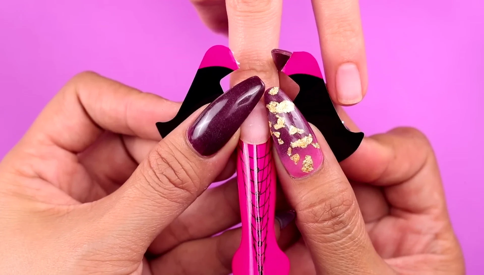 Securing the nail form under the natural nail