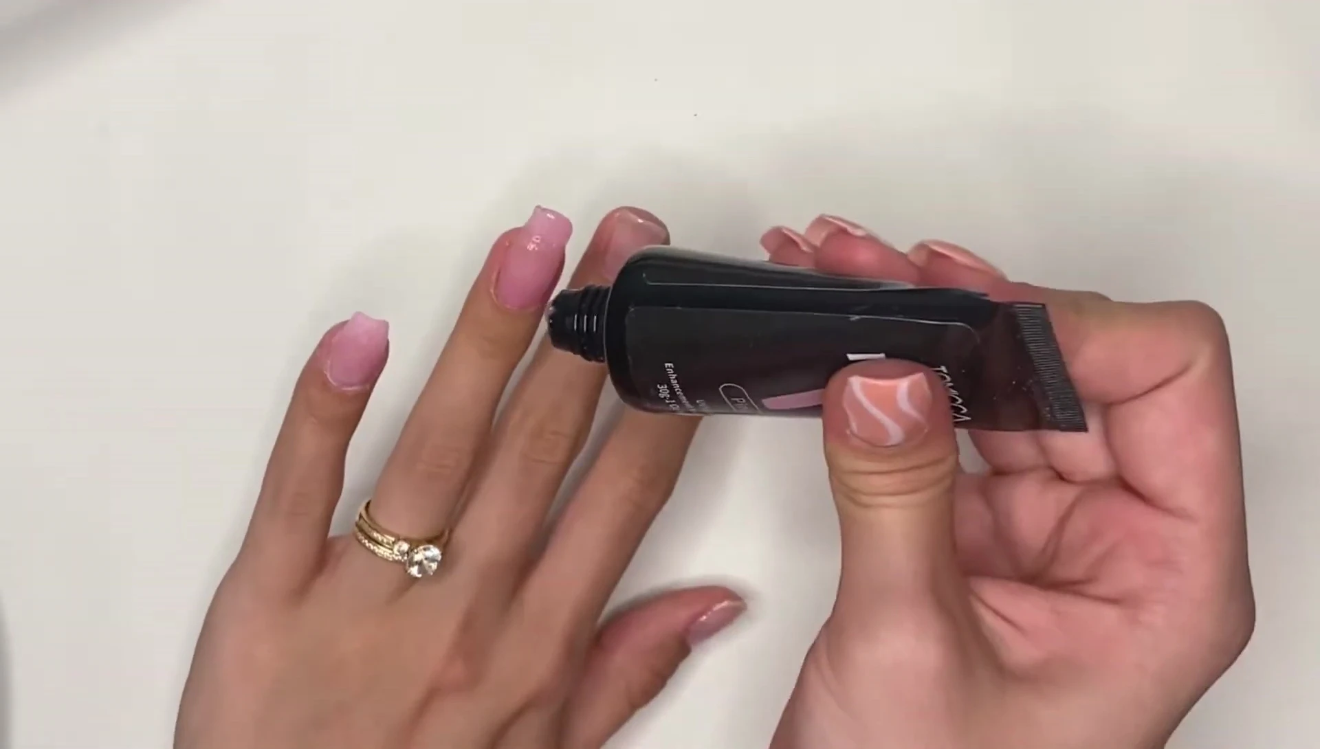 Applying the second layer of polygel.