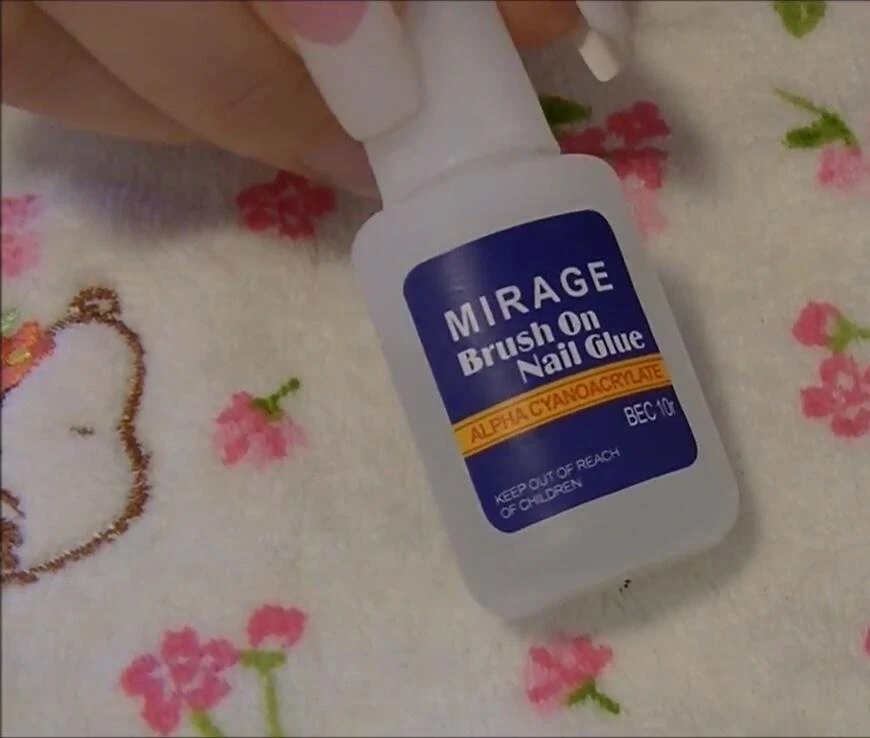 Applying nail glue and attaching the tip