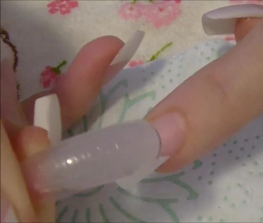 Securing the nail form and applying acrylic