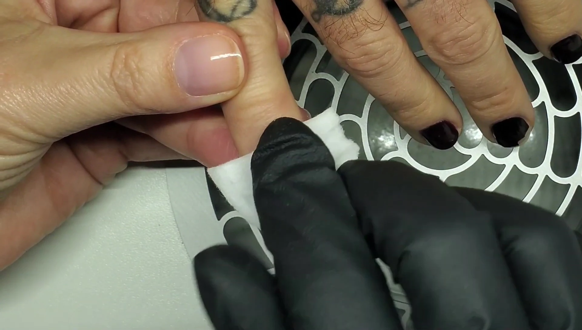 Saturating a cotton pad with acetone