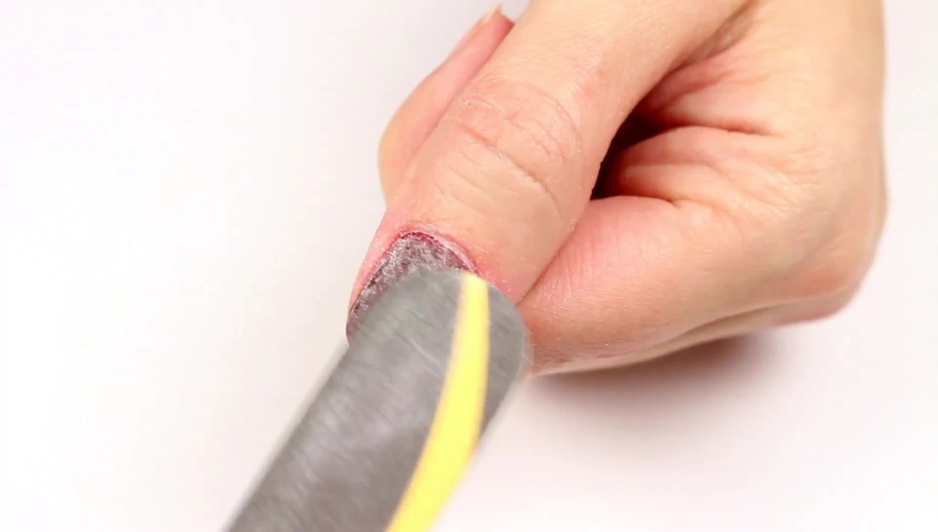 Preparing the dip powder nails before application of the remover