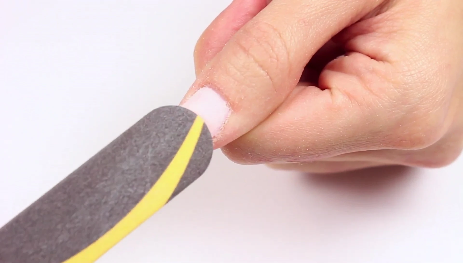 Preparing the gel nails before application of the remover