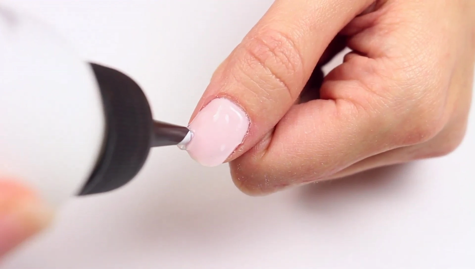 Applying the remover to the gel polish