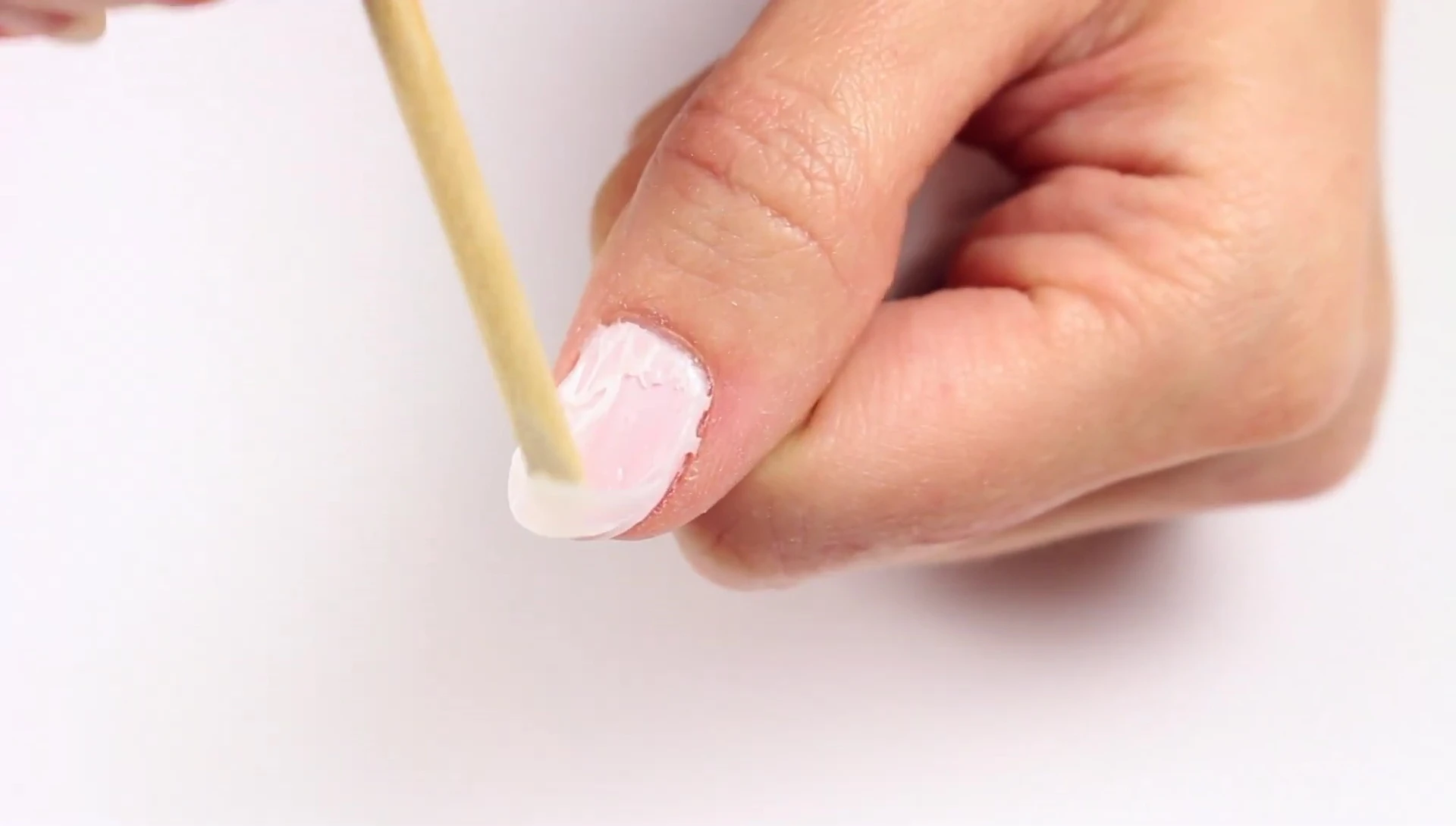 Removing the softened gel polish after the first application
