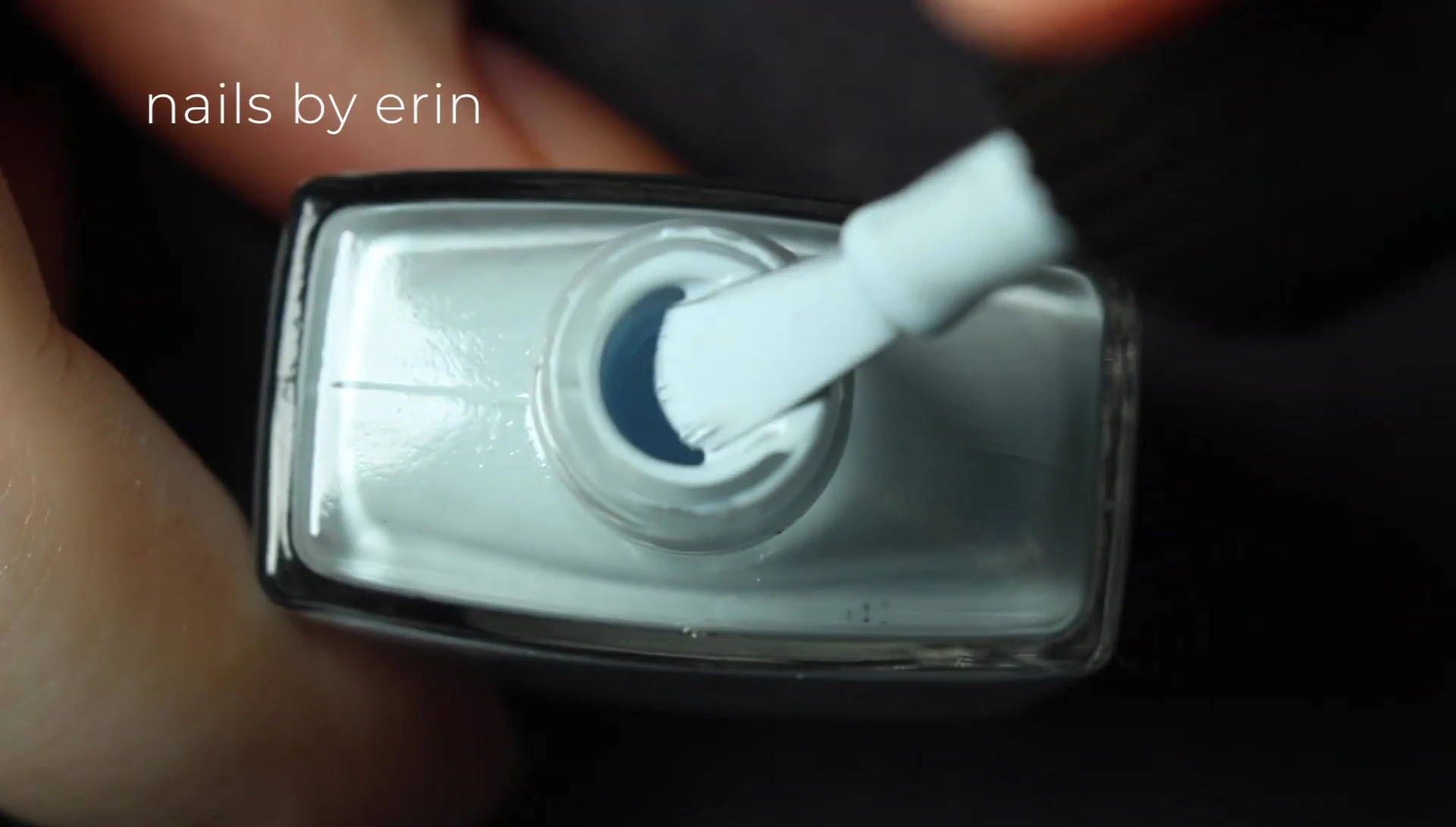 Close-up of Candy Floss nail polish bottle and swatch on the nail.