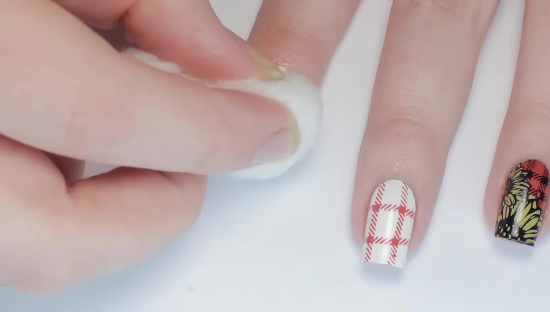 The process of removing the nail polish is shown.